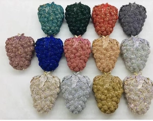 Detailed view of luxury strawberry-shaped evening bags in 13 vibrant rhinestone colors