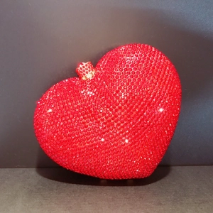 Elegant red heart-shaped evening clutch bag with sparkling rhinestones and crown clasp