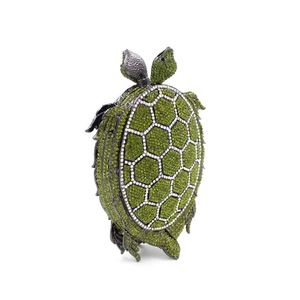 Macro shot of grass green crystal turtle clutch showing intricate rhinestone craftsmanship