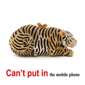 Detailed view of the tiger-shaped evening clutch with gold rhinestones and butterfly clasp