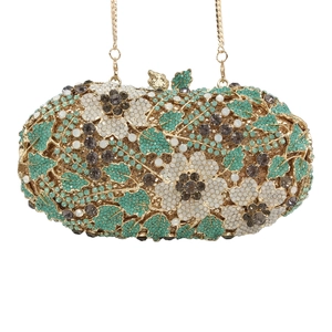 Luxurious crystal clutch bag with white flower and green leaf patterns on golden chain