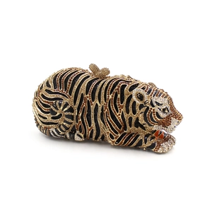 Detailed view of tiger evening clutch with amber rhinestones and gold bow clasp