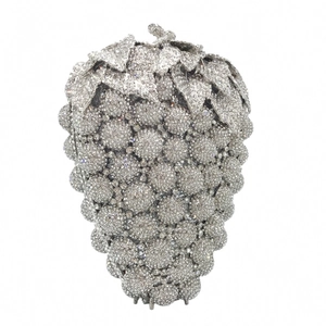 Detailed macro view of silver grape-shaped evening bag with shimmering rhinestones