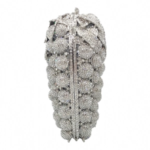 Close-up of grape-shaped evening clutch with crystal rhinestones and leaf clasp