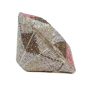 Close-up of geometric diamond-shaped evening clutch bag with sparkling multicolor rhinestones