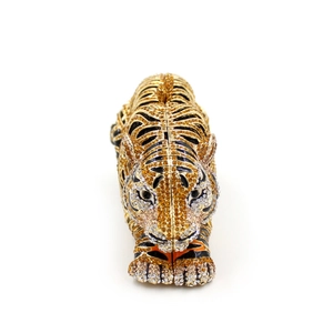 Close-up of sparkling tiger-shaped evening clutch with detailed crystal rhinestone patterns