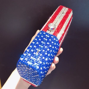 Macro detail of hand-set rhinestones and American flag pattern on rectangular evening clutch
