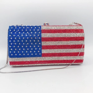 Detailed shot of US flag rhinestone evening clutch bag with sparkling crystals and silver chain