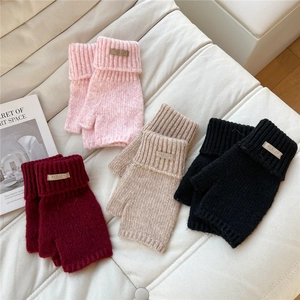 Cozy fingerless knitted gloves for women in four colors with ribbed cuffs and woven tags