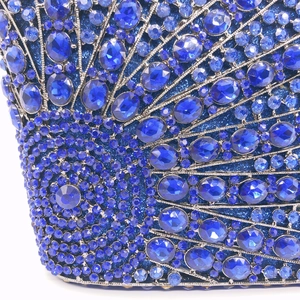 Detail of royal blue rhinestones and gems in a fan pattern on a luxury evening clutch