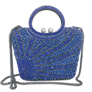 Elegant blue crystal dinner clutch with round rhinestone handle and pearl clasp detail