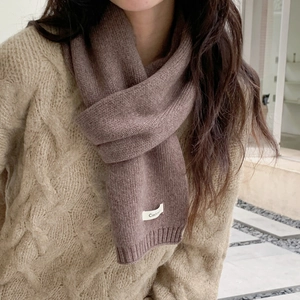 Detail showing soft cashmere knit texture and ribbed edge of this warm winter scarf