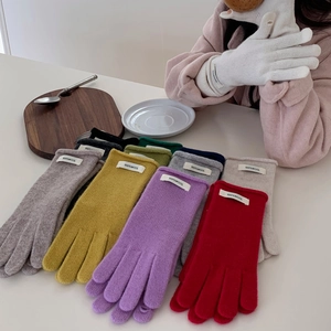 High-quality winter knit gloves in various colors with touch screen feature and 100% wool label