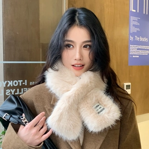 Plush cross-style faux fur scarf in beige, soft winter neck warmer with brand label
