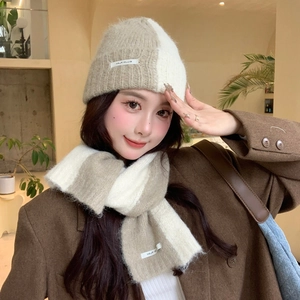 Knit beanie and scarf set in beige and white color block with soft plush texture