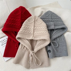 Women's knitted balaclava hooded scarves in red, beige, and dark grey with cable knit detail