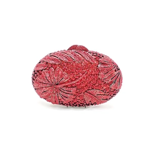 Macro detail of exquisite floral rhinestone patterns on the pink evening clutch bag