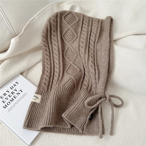 Detailed cable knit texture on brown Balaclava scarf with buttons and drawstring