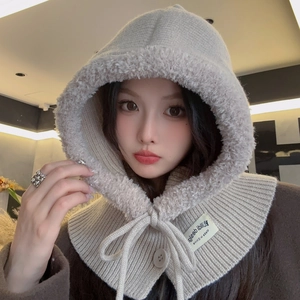Detail of knitted balaclava hood featuring plush fleece lining and drawstring toggle