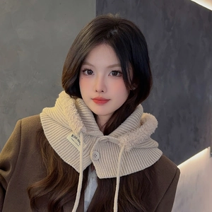 Detail of beige knit balaclava hood showing soft faux fur lining and drawstring