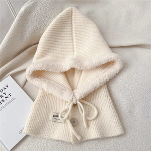 Detail of cream knit balaclava with soft faux fur trim and adjustable drawstring button