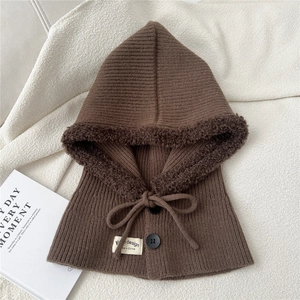 Detail view of brown knit balaclava with warm faux fur lining and decorative buttons