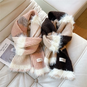 Striped knitted winter scarf with faux fur trim in pink and brown color block style