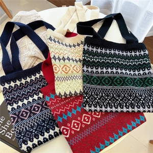 Four Fair Isle knit tote bags with geometric patterns on a white table for autumn winter