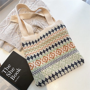 Close-up of geometric knit tote bag with thick texture and durable woven handles