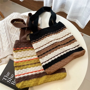 Handmade striped knit tote bag with thick woolen texture and vibrant color block design