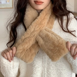 Detail of light camel faux fur scarf showing the cable knit pattern and cross-tuck design