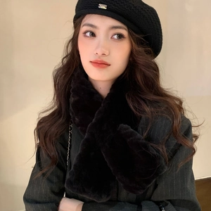 Detail of soft black plush scarf and knitted beret with metallic letter logo accent