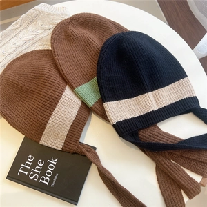 Striped knit beanie with long earflap ties in assorted vintage contrast colors