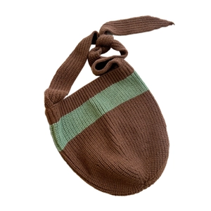 Brown knitted crossbody bag with green stripes and adjustable knotted strap design