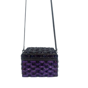 Close-up of luxury purple crystal clutch bag with woven texture and black metal chain