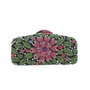 Detailed macro view of multi-color crystal floral pattern on this stone evening bag