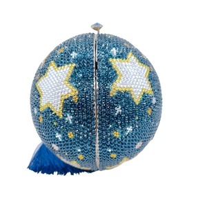 Close-up of star pattern on navy blue rhinestone ball clutch with elegant gold hardware