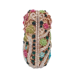 Detailed view of colorful floral crystal encrusted clutch bag with gold metal hardware