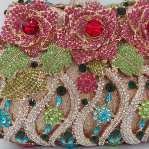 Macro detail of luxury crystal floral clutch showing intricate rose rhinestones and metalwork