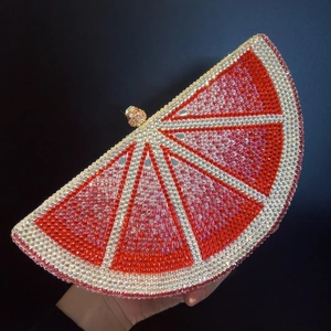 Luxury grapefruit crystal clutch bag with red rhinestones and gold metal frame
