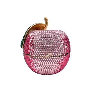 Luxurious apple-shaped crystal clutch bag featuring pink gradients and a gold stem detail