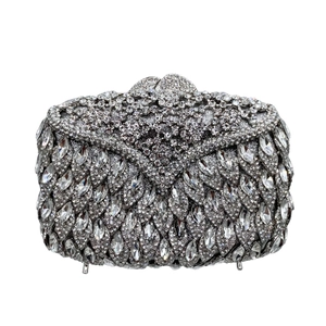 Macro view of silver evening bag with marquise rhinestones and metal clasp closure