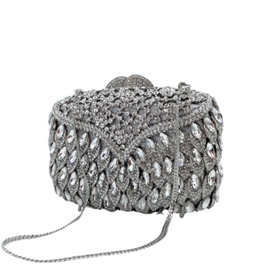 Elegant silver rhinestone evening clutch bag with metal frame and crystal inlay