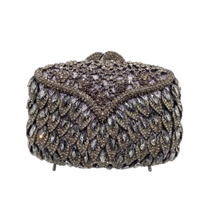 Detailed macro view of the rhinestone evening bag with intricate crystal leaf patterns