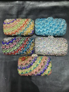 Detail view of heart-shaped scale luxury stone clutches with colorful rhinestones