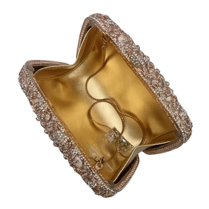 Elegant hollow floral crystal clutch bag in rose gold with chain strap and spare diamonds