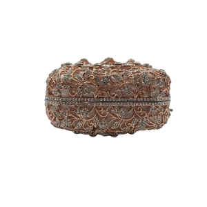 Elegant rose gold hollow crystal clutch bag for women featuring floral engravings