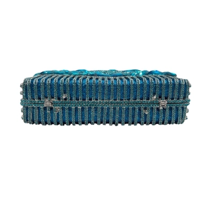 Royal blue evening clutch bag with vertical crystal stripes and gemstone clasp