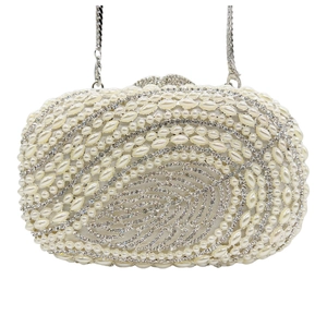 Close-up of artificial pearls and crystal leaf patterns on a luxury evening clutch bag