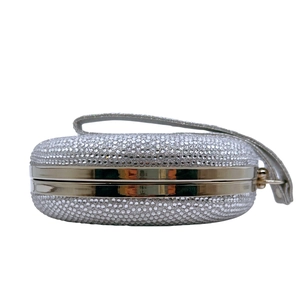 Sparkling silver round diamond evening clutch bag with rhinestone surface and metal handle